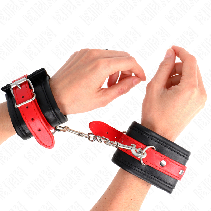 KINK - HANDGELENKFESSELN SCHWARZ MIT ROTEM GÜRTEL VERSTELLBAR 17-28 CM